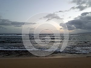 Shallow wavy ocean waters of Camp Mokuleia Beach