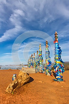 Shaman poles of serge on Olkhon in the sunset with long shadows