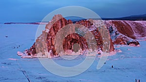 Shaman rock in frozen lake Baikal