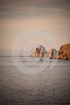 Shaman rock on lake Baykal in Russia photo