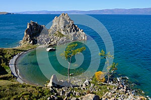 Shamanka Rock on Baikal lake near Khuzhir at Olkhon island in Siberia, Russia in September. Lake Baikal is the largest
