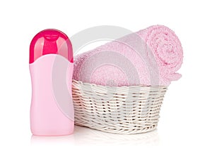 Shampoo bottle and pink towel