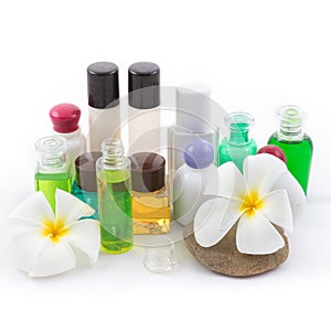 The shampoo bottle set with plumeria flower in spa