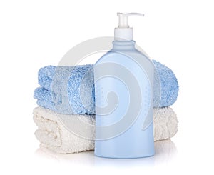 Shampoo bottle and towels