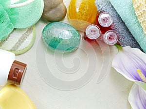 Shampoo soap bar and liquid shower gel towels spa kit top view with space copy background