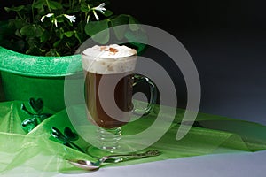 Shamrocks and Irish coffee on dark