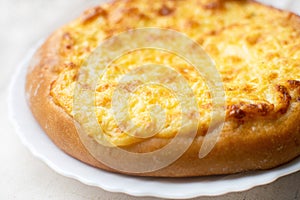 Shanga: traditional Russian pastries with potatoes and eggs. Khachapuri with cheese, egg and garlic.