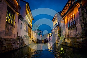 SHANGHAI, CHINA - 29 JANUARY, 2017: Beautiful evening light creates magic mood inside Zhouzhuang water town, ancient