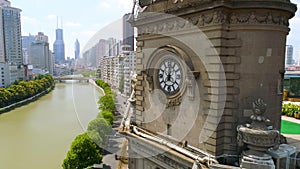 SHANGHAI, CHINA - JULY 2016: Aerial drone view of shanghai post office tower with clocks, sculpture