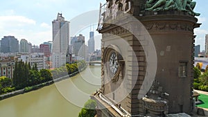 SHANGHAI, CHINA - JULY 2016: Aerial drone view of shanghai post office tower with clocks, sculpture