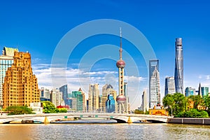 Shanghai pudong skyline with historical Waibaidu bridge, China during summer sunny day