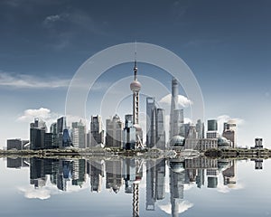 Shanghai skyline against a sunny sky and reflection