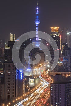 Shanghai skyline at night with the Oriental Pearl Tower on background