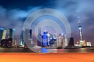 Shanghai skyline with pier at night