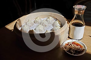 Shanghai soup dumpling steamed in bamboo bowl - Xiao Long Bao ma