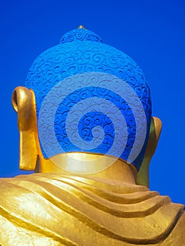 Shanti Ban Buddha head, 25 feet tall golden Buddha`s image on a sunny day in Dhulikhel, Nepal