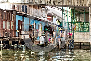 Shanty-town. on canal in Thailand photo
