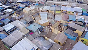 Shantytown in Lima. Poor families living in wooden precarious houses.