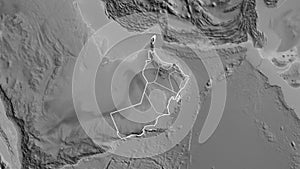 Shape of Oman with regional borders. Grayscale.