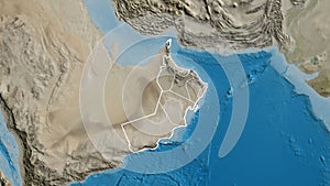 Shape of Oman with regional borders. Satellite.