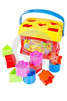 Shape sorter toy with various coloured blocks isolated photo