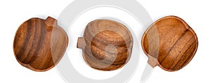 Shaped apple wooden bowls isolated on white. Set of empty wood bowls for dry fruits and nuts in collage for your design