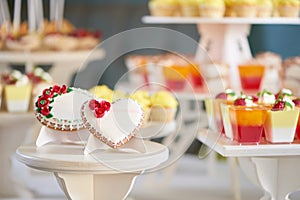 Shaped glazed cookies near the candybar