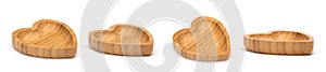 Shaped heart wooden bowls isolated on white. Set of empty wood bowls for dry fruits and nuts in collage for your design.