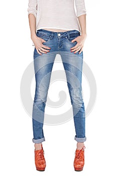 Shapely female legs dressed in blue jeans