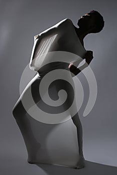 Shapely Woman in Creative Light and Spandex Fabric