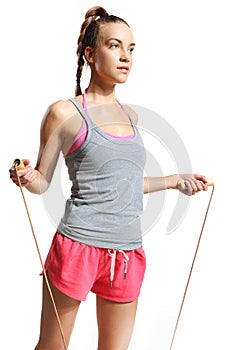Shapely woman exercising with a jump rope