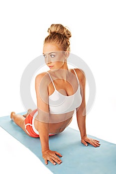 Shapely young woman doing press-ups