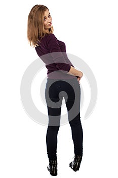 Shapely young woman looking back at the camera
