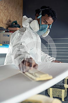 Shaper working on surf board