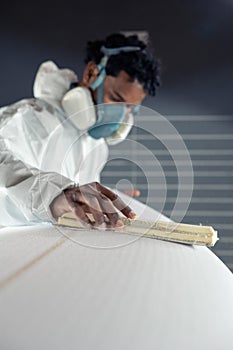 Shaper working on surf board