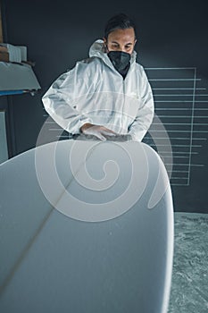 Shaper working on surf board