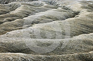 Shapes in ground formed by the mud flows at Muddy Volcanoes of Paclele Mari, near Buzau.