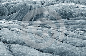 Shapes in ground formed by the mud flows at Muddy Volcanoes of Paclele Mari, near Buzau.