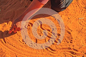 Shapes with red sand in aboriginal art style