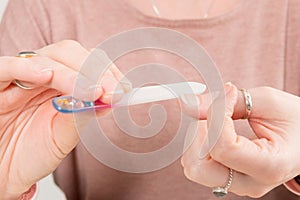 Shaping Fingernails with a Glass Nail File photo