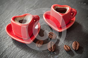 Shaping heart cup of coffee with coffee beans decorat
