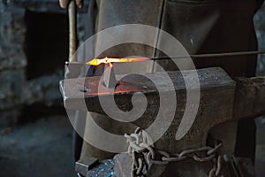 Shaping White-Hot Iron on an Anvil