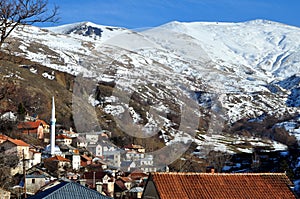 Shar mountain village Zlipotok in winter, and Ovcinec peaksouthern Kosovo