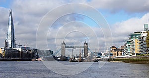 The shard and Tower bridge over Thames river in London photo
