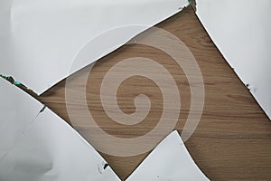 Shards of broken mirror on wooden backing board, top view