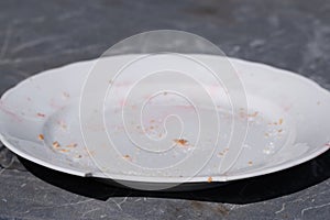 Shards of a broken white plate isolated on white background