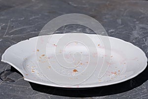 Shards of a broken white plate isolated on white background