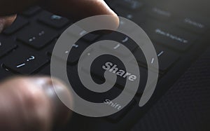 Share button on keyboard. Concept on sharing content at internet