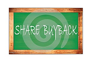 SHARE  BUYBACK text written on green school board