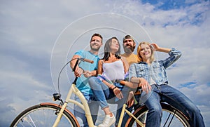 Share or rental bike service. Company stylish young people spend leisure outdoors sky background. Bicycle as best friend